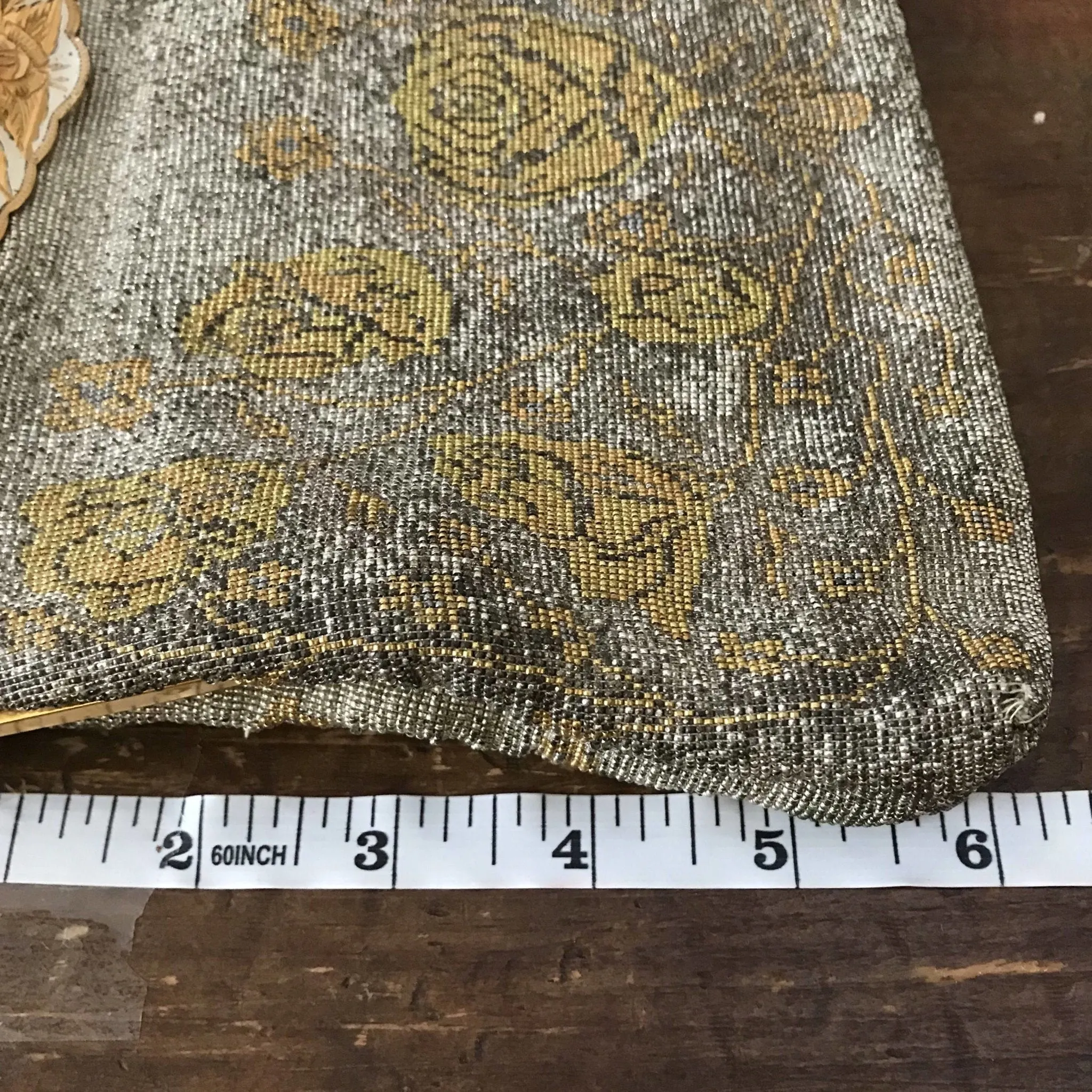Vintage Metal Mesh Metallic Clutch in Silver and Gold with a Floral design by Saks Fifth Avenue.