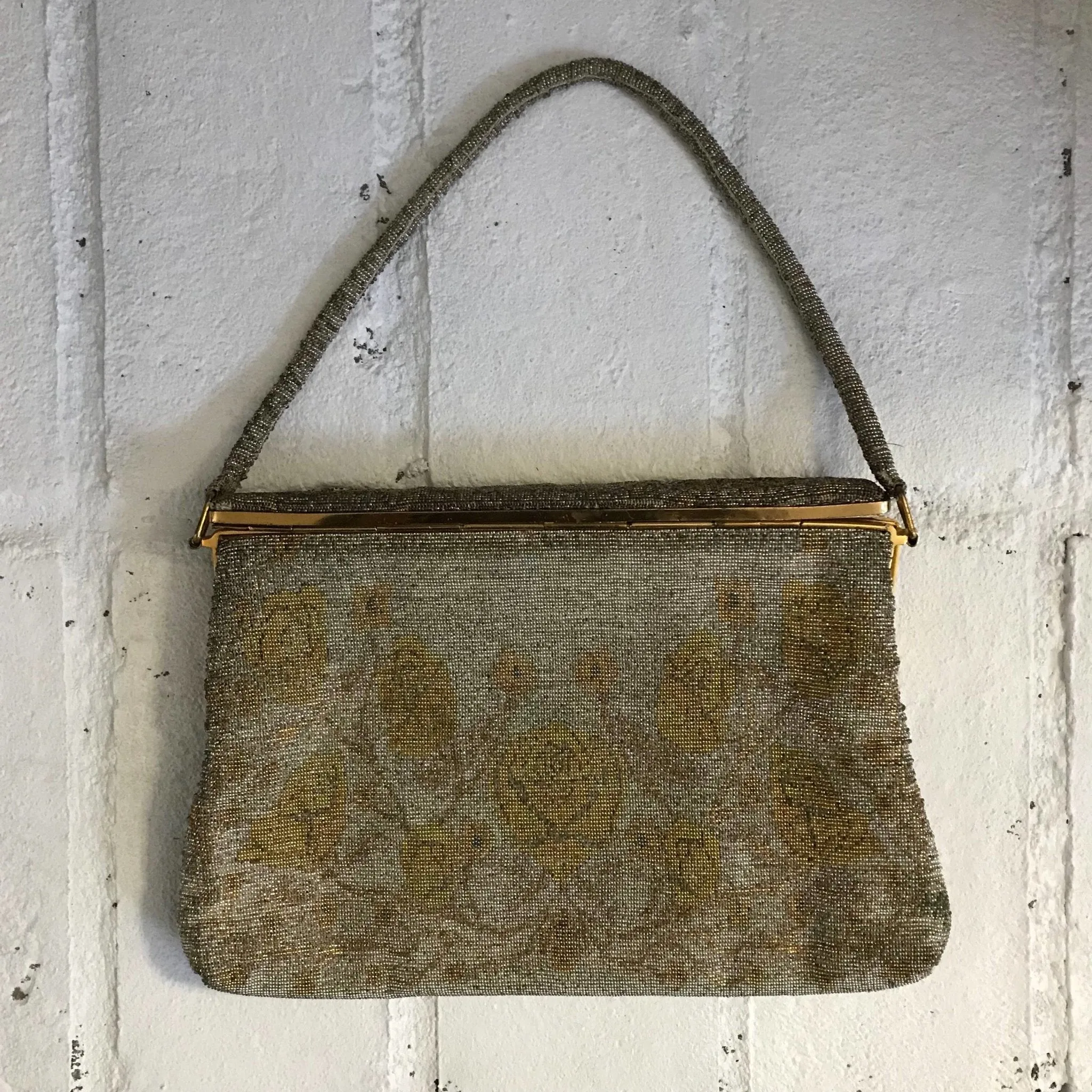 Vintage Metal Mesh Metallic Clutch in Silver and Gold with a Floral design by Saks Fifth Avenue.