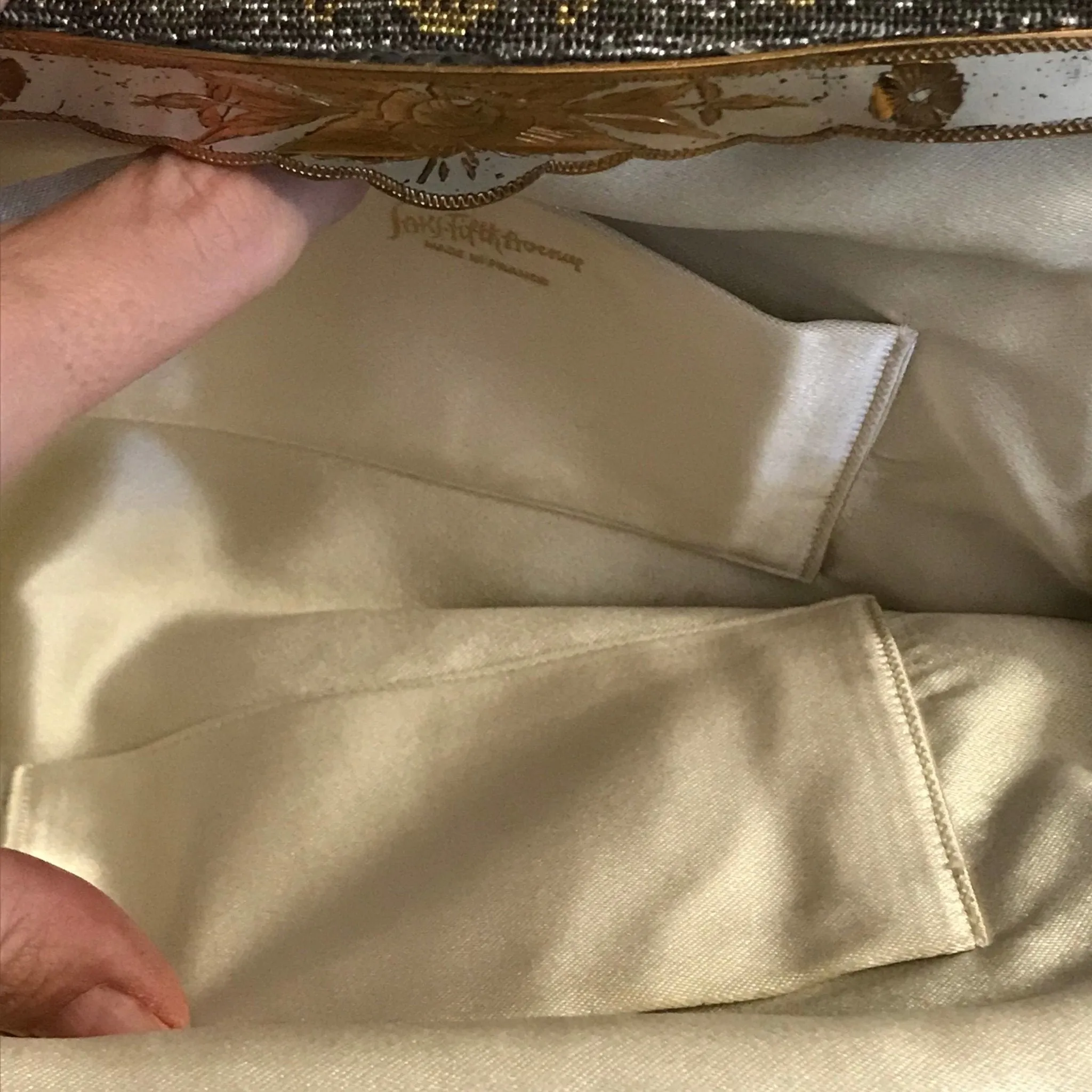 Vintage Metal Mesh Metallic Clutch in Silver and Gold with a Floral design by Saks Fifth Avenue.